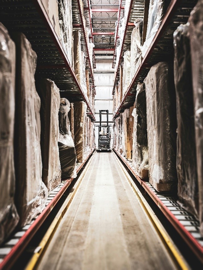 Forklift operator in a warehouse that is temperature monitored